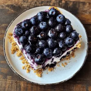 This No-bake Blueberry Yum Yum is the perfect easy dessert that combines creamy layers with fresh blueberries! Made with simple ingredients, it's a delightful treat for any occasion. Whether it's a summer picnic or a family gathering, this sweet dish will leave everyone wanting more. Save this pin to whip up this delicious recipe later!