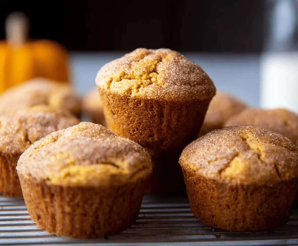 Delicious Pumpkin Snickerdoodle Muffins topped with cinnamon sugar, perfect for fall baking and pumpkin spice lovers