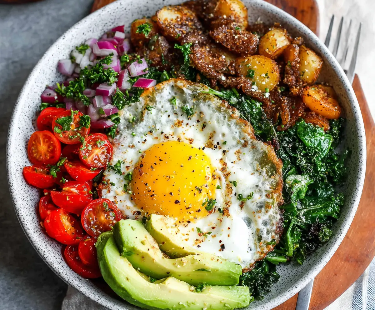 Healthy egg breakfast bowls with fresh vegetables and herbs for a nutritious start to your day.