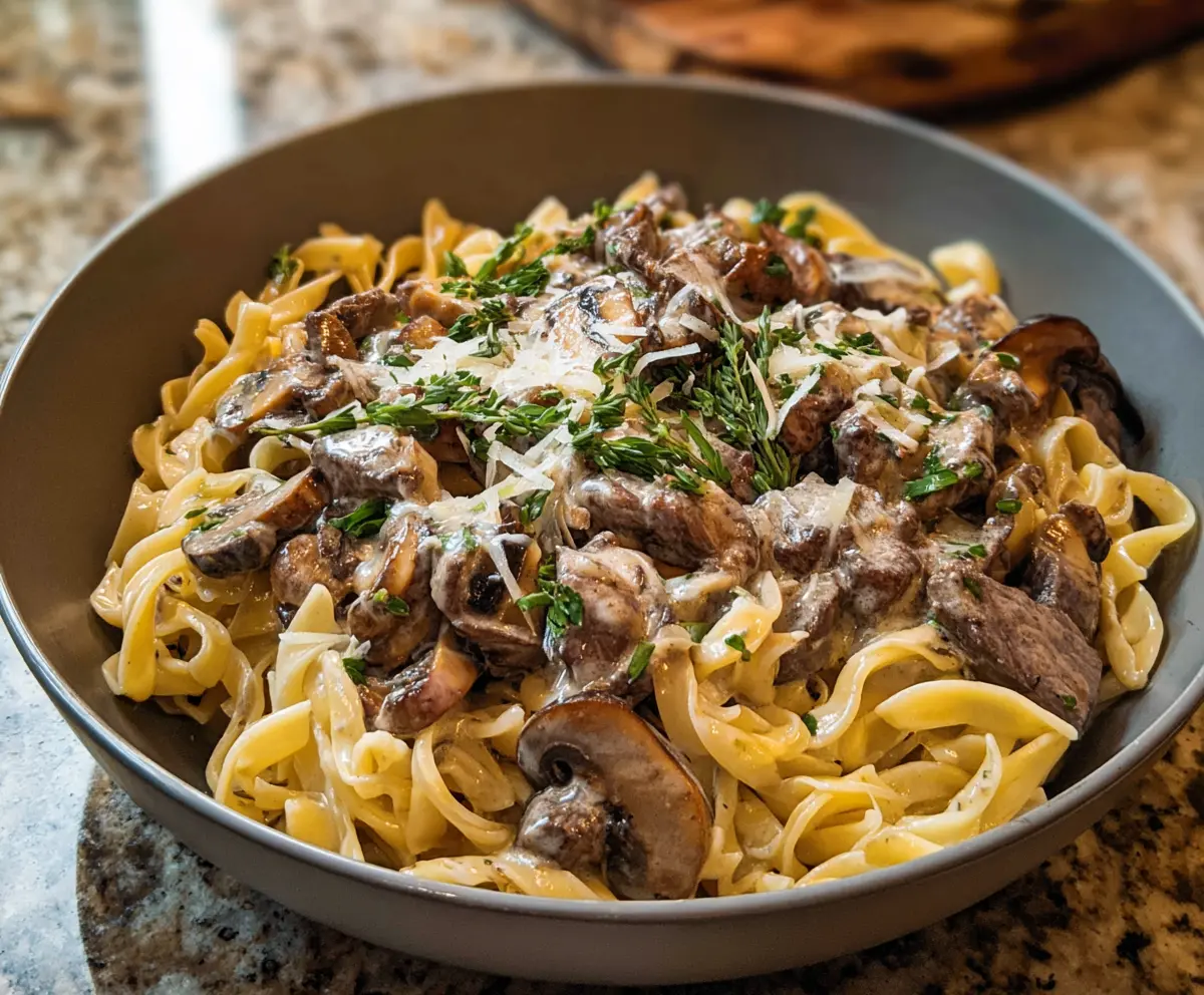 Creamy Beef Stroganoff pasta dish with tender beef strips and mushrooms served over noodles