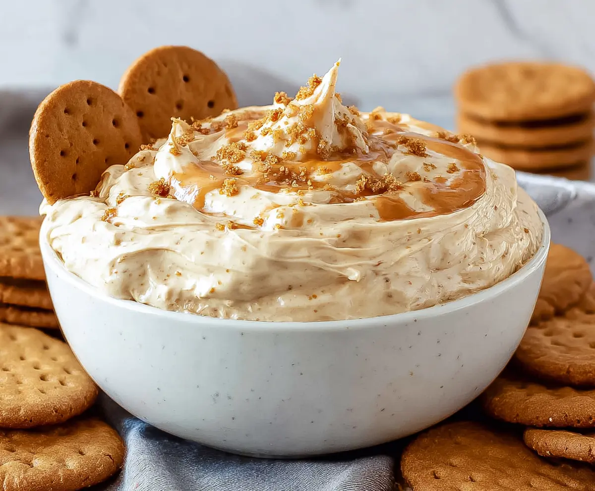 Creamy cookie butter dip served with cookies for a delicious snack or dessert