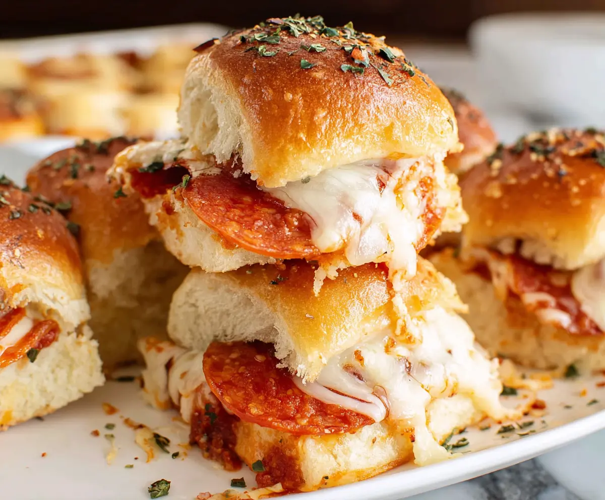Delicious pepperoni pizza sliders with melted cheese and crispy bread rolls perfect for snack time.