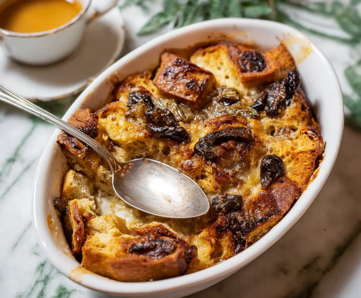 Delicious homemade sourdough bread pudding with a golden crust and creamy interior.