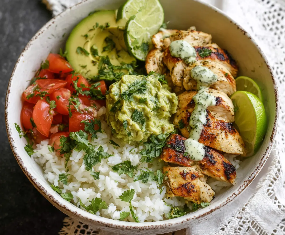 Delicious cilantro lime chicken bowls served with fresh vegetables and herbs.